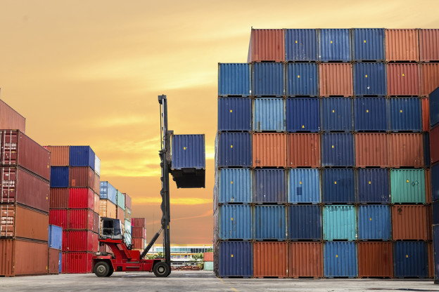 forklift handling the container box at dockyard